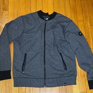 Gatorade Like- New Era Charcoal/Black Zip-Up Jacket.

Logo on the left sleeve